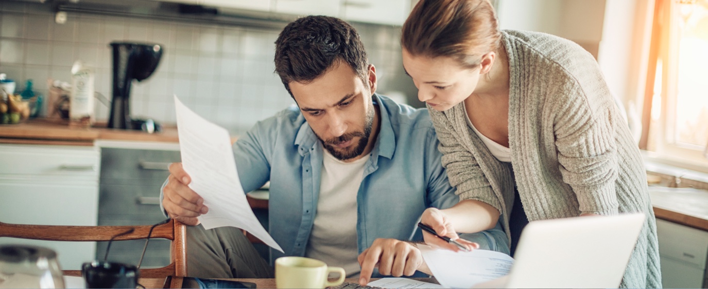 woman and man looking at paper